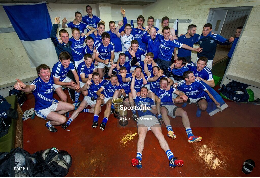 12 October 2014; Double County Champions Cratloe celebrate with their cups in the dressing room after victory over Eire Og. Clare County Senior Football Championship Final, Cratloe v Eire Og. Cusack Park, Ennis, Co. Clare. Picture credit: Diarmuid Greene / SPORTSFILE