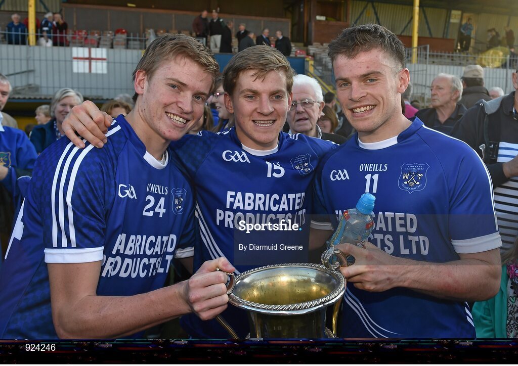 12 October 2014; Cratloe players, and brothers, from left to right, David Collins, Padraic Collins, and Sean Collins celebrate with the cups after victory over Eire Og. Clare County Senior Football Championship Final, Cratloe v Eire Og. Cusack Park, Ennis, Co. Clare. Picture credit: Diarmuid Greene / SPORTSFILE