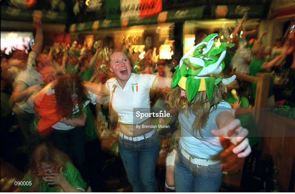 5 June 2002; Republic of Ireland fan Karen Reilly, centre, celebrates with patrons after Robbie Keane's late equaliser against Germany in the FIFA World Cup Finals. The Submarine Bar, Dublin. Picture credit: Brendan Moran / SPORTSFILE