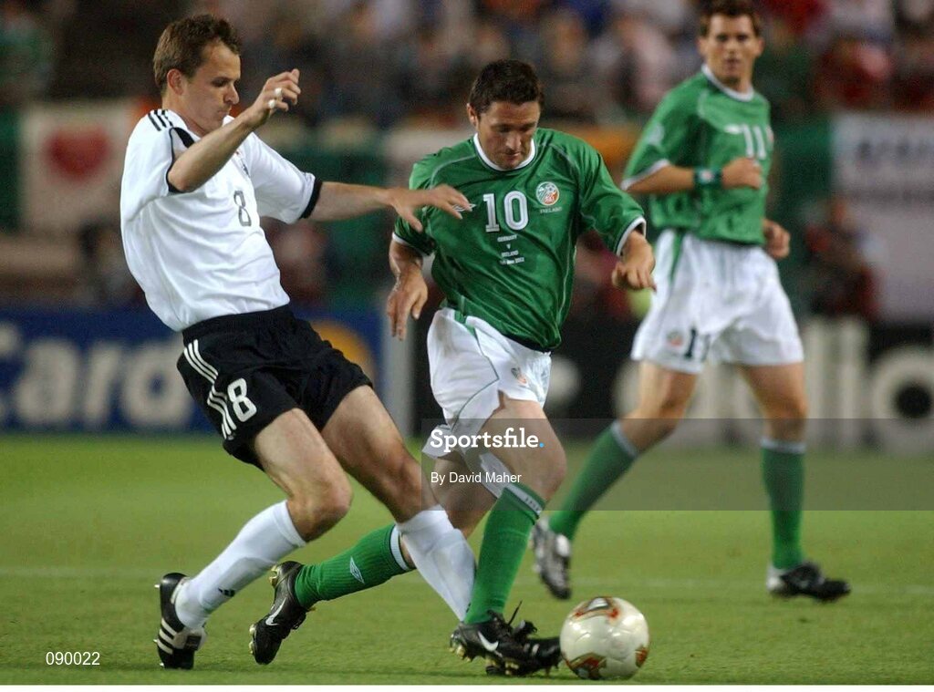 5 June 2002; Robbie Keane, Republic of Ireland, is tackled by Dietmar Hamann, Germany. FIFA World Cup Finals, Group E, Republic of Ireland v Germany, Ibaraki Stadium, Ibaraki, Japan. Picture credit: David Maher / SPORTSFILE