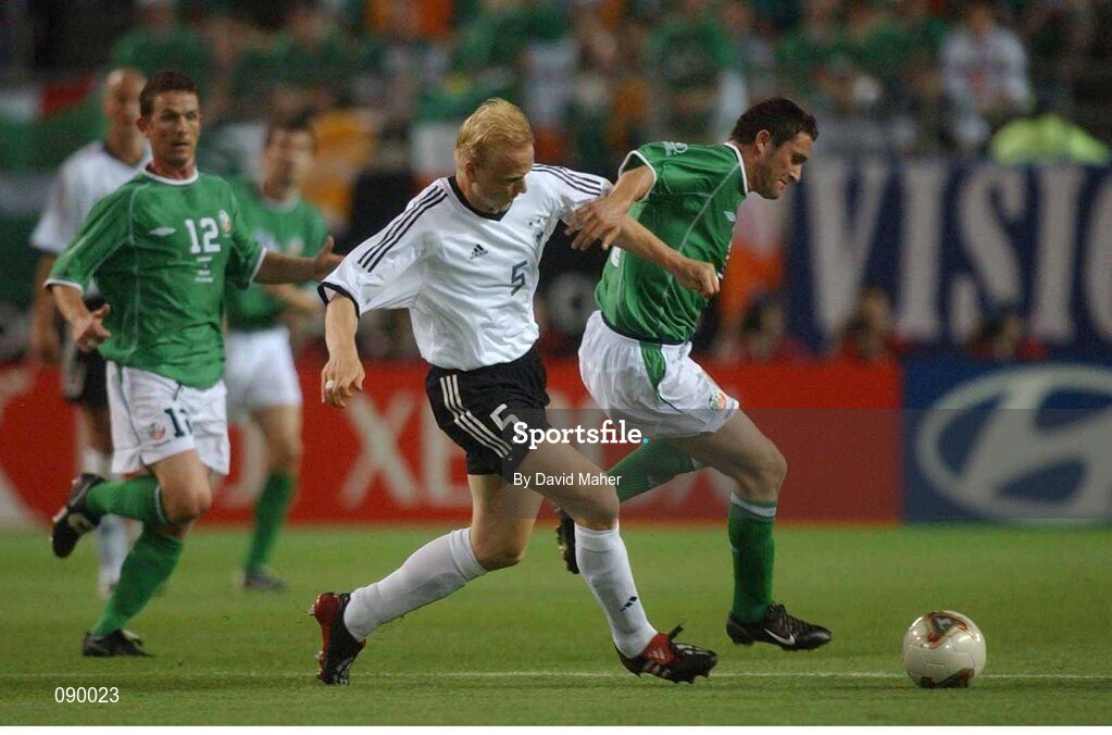 5 June 2002; Robbie Keane, Republic of Ireland, is tackled by Carsten Ramelow, Germany. FIFA World Cup Finals, Group E, Republic of Ireland v Germany, Ibaraki Stadium, Ibaraki, Japan. Picture credit: David Maher / SPORTSFILE