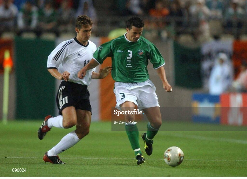 5 June 2002; Ian Harte, Republic of Ireland, is tackled by Miroslav Klose, Germany. FIFA World Cup Finals, Group E, Republic of Ireland v Germany, Ibaraki Stadium, Ibaraki, Japan. Picture credit: David Maher / SPORTSFILE