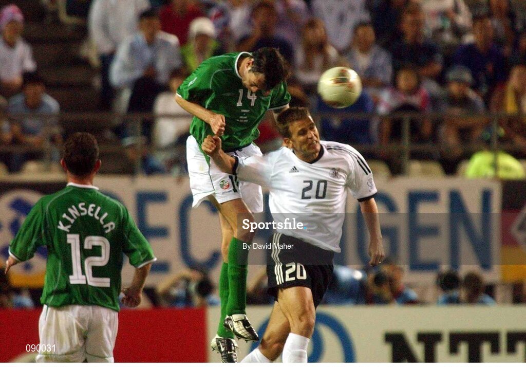 5 June 2002; Gary Breen, Republic of Ireland, heads clear of Oliver Bierhoff, Germany. FIFA World Cup Finals, Group E, Republic of Ireland v Germany, Ibaraki Stadium, Ibaraki, Japan. Picture credit: David Maher / SPORTSFILE