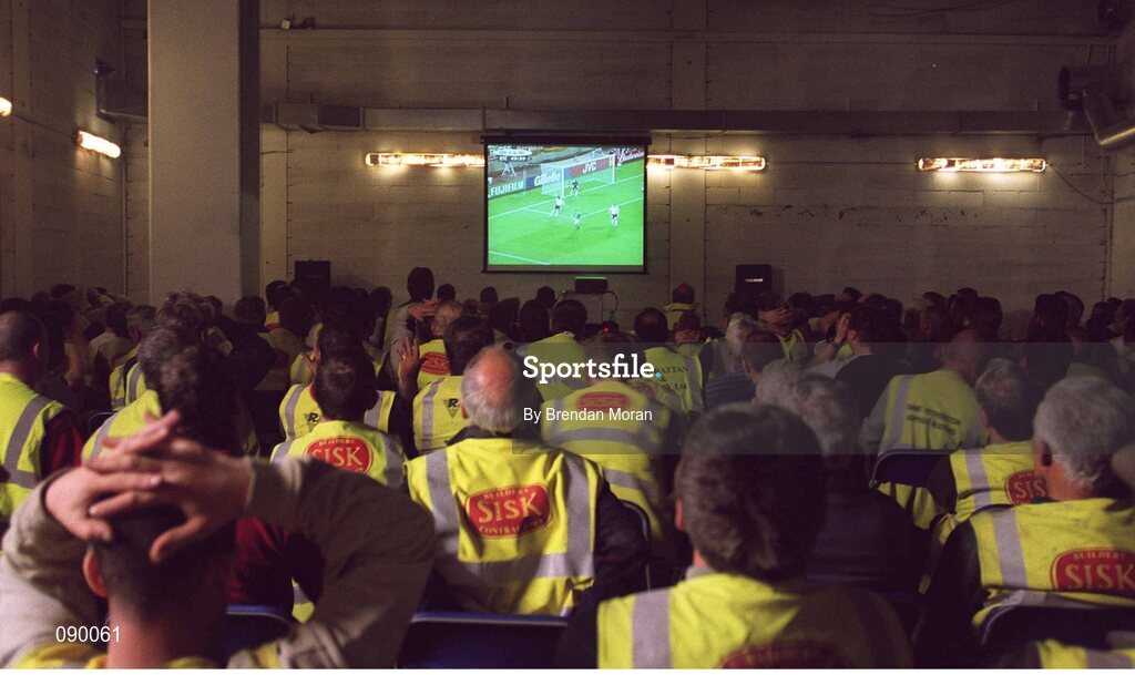 5 June 2002; Building workers employed in the construction of the new stand at Croke Park watch a live broadcast of the Republic of Ireland v Germany game at the FIFA World Cup Finals. Picture credit: Brendan Moran / SPORTSFILE