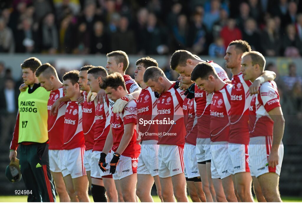 12 October 2014; The Eire Og team stand together during the playing of the National Anthem. Clare County Senior Football Championship Final, Cratloe v Eire Og. Cusack Park, Ennis, Co. Clare. Picture credit: Diarmuid Greene / SPORTSFILE
