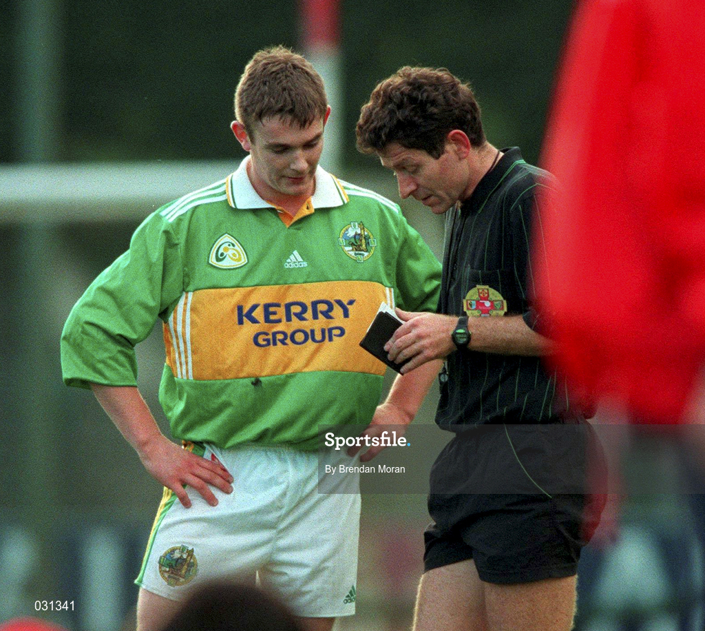 30 October 1999; Enda Galvin of Kerry is booked by referee Brian White during the Church & General National Football League Division 1A Round 1 match between Cork and Kerry at Paric Ui Rinn in Cork. Photo by Brendan Moran/Sportsfile