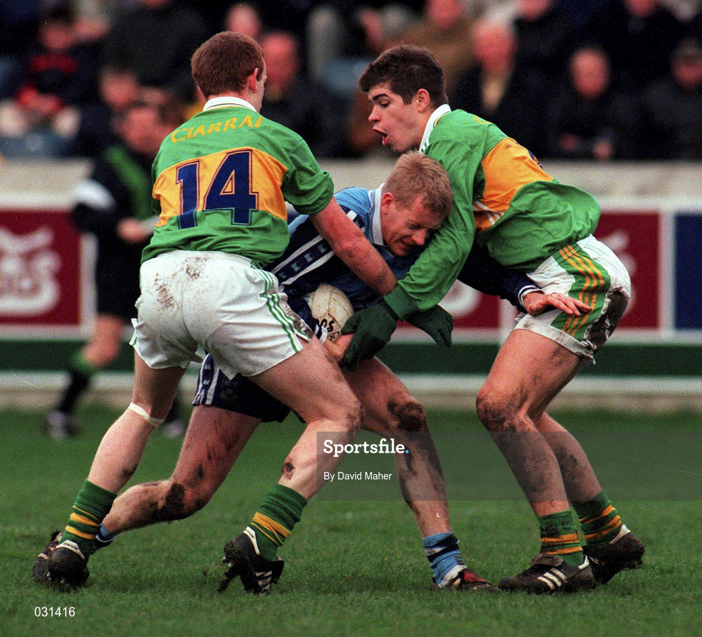 28 November 1999; Declan D'Arcy of Dublin is tackled by Liam Hassett, left, and Eamonn Fitzmaurice of Kerry during the Church & General National Football League match between Dublin and Kerry at Parnell Park in Dublin. Photo by David Maher/Sportsfile