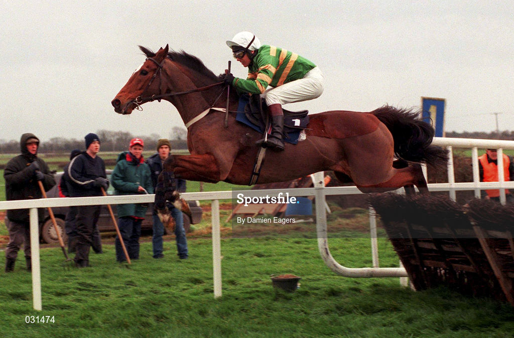 28 November 1999; Istabraq, with Charlie Swan up, clears the first to finish second behind Limestone Lad during the Duggan Brothers Hattons Grace Hurdle at Fairyhouse Racecourse in Ratoath, Meath. Photo by Damien Eagers/Sportsfile