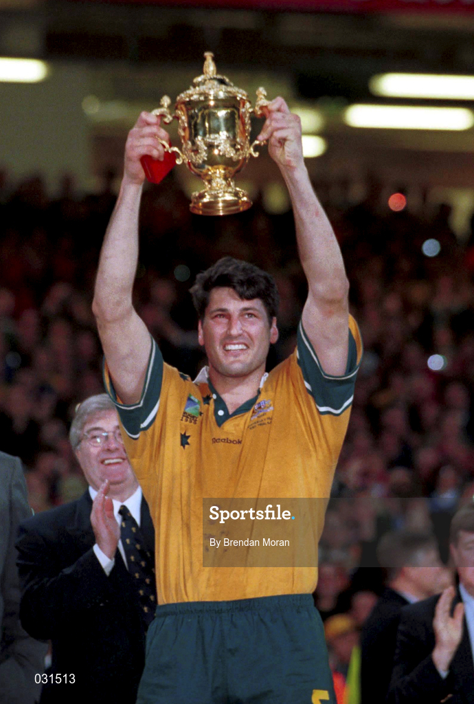 6 November 1999; Australia captain John Eales lifts the Webb Ellis Cup following the Rugby World Cup Final match between Australia and France at the Millenium Stadium in Cardiff, Wales. Photo by Brendan Moran/Sportsfile