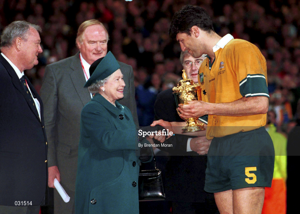 6 November 1999; Australia captain John Eales receives the Webb Ellis Cup from HRH Queen Elizabeth following the Rugby World Cup Final match between Australia and France at the Millenium Stadium in Cardiff, Wales. Photo by Brendan Moran/Sportsfile