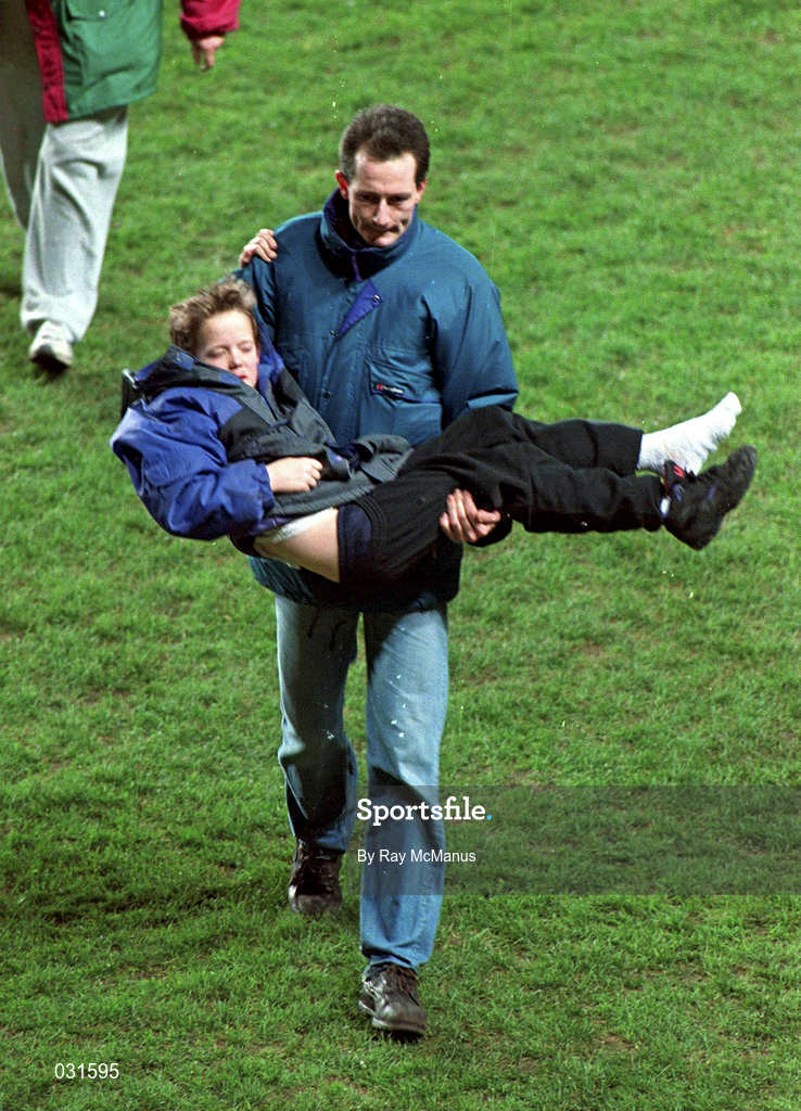 15 Feburary 1995; A young child is carried to safety after rioting broke out in the Upper West Stand forcing the abandonment of the international friendly match between Republic of Ireland and England at Lansdowne Road in Dublin. Photo by Ray McManus/Sportsfile