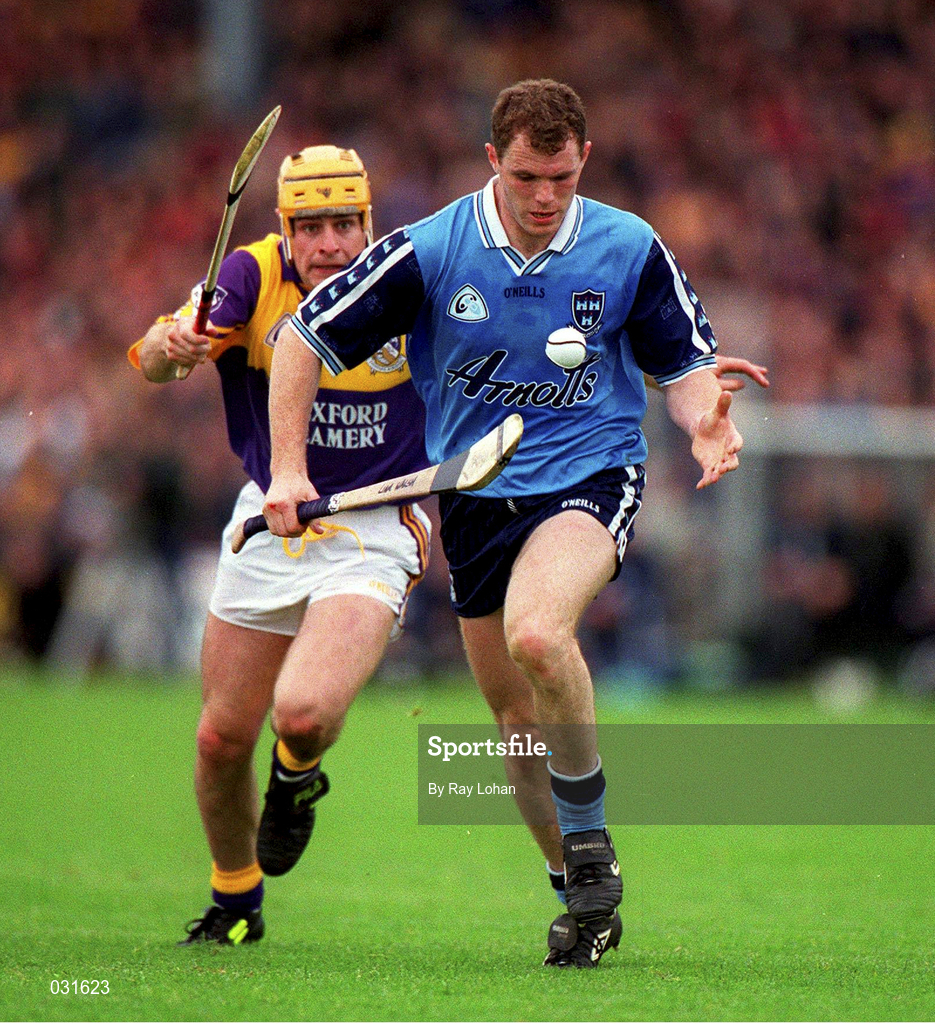 30 May 1999; Liam Walsh of Dublin in action against Adrian Fenlon of Wexford during the Guinness Leinster Senior Hurling Championship Quarter-Final match between Dublin and Wexford at Nowlan Park in Kilkenny. Photo by Ray Lohan/Sportsfile