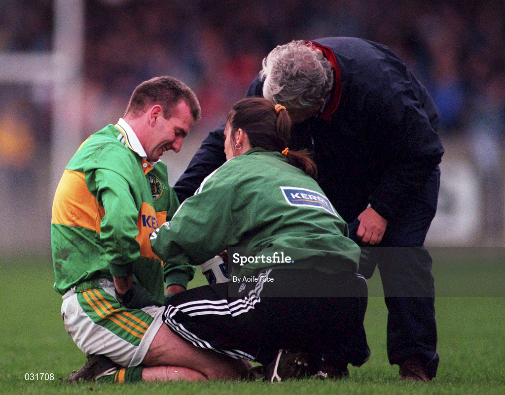 28 November 1999; Mike Hassett of Kerry is attended to after picking up an injury during the Church & General National Football League match between Dublin and Kerry at Parnell Park in Dublin. Photo by Aoife Rice/Sportsfile