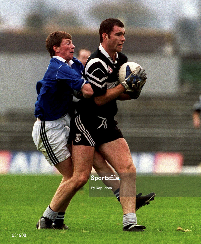 7 November 1999; Senan Hehir of Doonbeg is tackled by Brendan Fitzgerald of Laune Rangers during the AIB Munster Senior Club Football Championship semi-final match between Doonbeg and Laune Rangers at Fitzgerald Stadium in Killarney, Kerry. Photo by Ray Lohan/Sportsfile