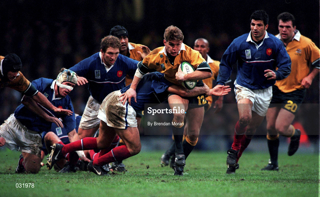 6 November 1999; Tim Horan of Australia is tackled by Raphael Ibanez of France during the Rugby World Cup Final match between Australia and France at the Millenium Stadium in Cardiff, Wales. Photo by Brendan Moran/Sportsfile