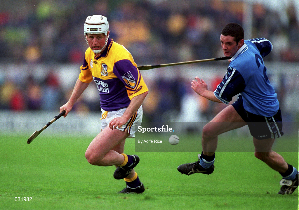 30 May 1999; Tom Dempsey of Wexford in action against John Finnegan of Dublin during the Guinness Leinster Senior Hurling Championship Quarter-Final match between Dublin and Wexford at Nowlan Park in Kilkenny. Photo by Aoife Rice/Sportsfile