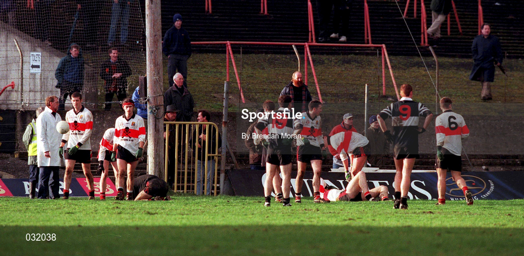 12 December 1999. Two UCC players lie on the ground after an altercation which resulted in Doonbeg player Gerry Killeen being sent off during the AIB Munster Senior Club Football Championship Final match between UCC and Doonbeg at the Gaelic Grounds in Limerick. Photo by Brendan Moran/Sportsfile