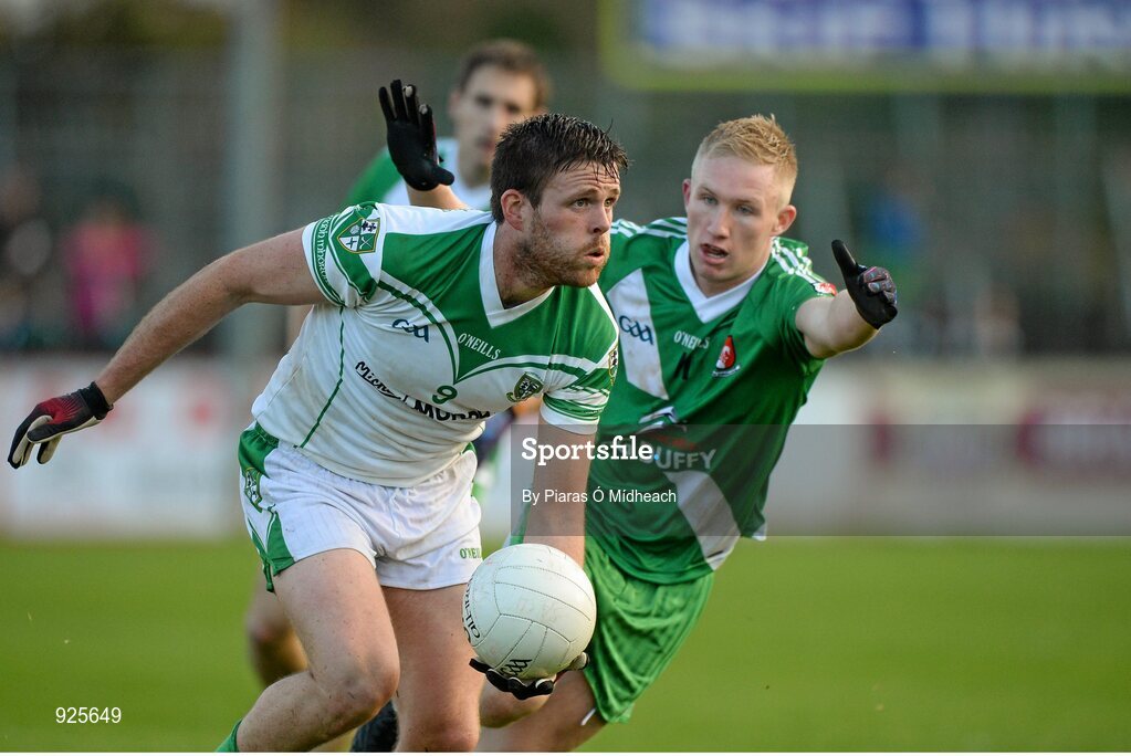 19 October 2014; Cian O'Connor, Moorefield, in action against Ray Cahill, Sarsfields. Kildare County Senior Football Championship Final, Sarsfields v Moorefield, St Conleth's Park, Newbridge, Co. Kildare. Picture credit: Piaras Ó Mídheach / SPORTSFILE