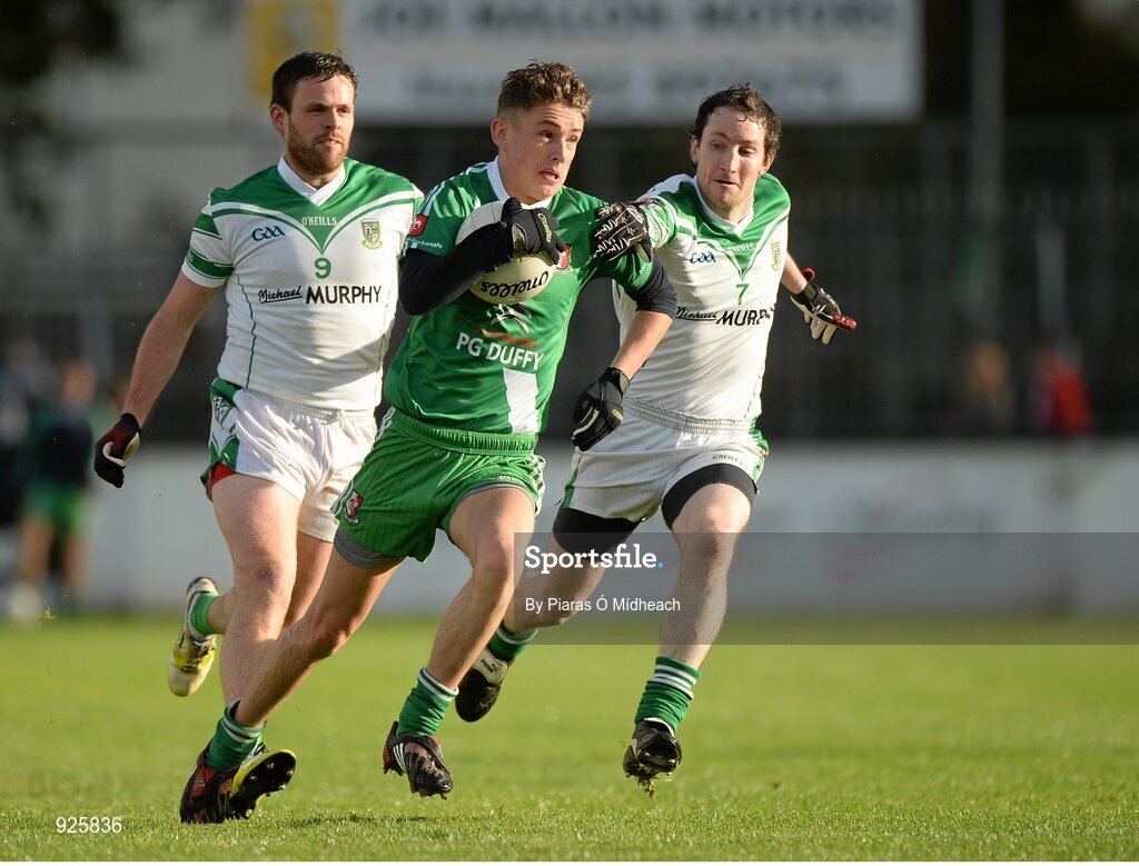 19 October 2014; Declan McKenna, Sarsfields, in action against Cian O'Connor, left, and Pádraig O'Flynn, Moorefield. Kildare County Senior Football Championship Final, Sarsfields v Moorefield, St Conleth's Park, Newbridge, Co. Kildare. Picture credit: Piaras Ó Mídheach / SPORTSFILE
