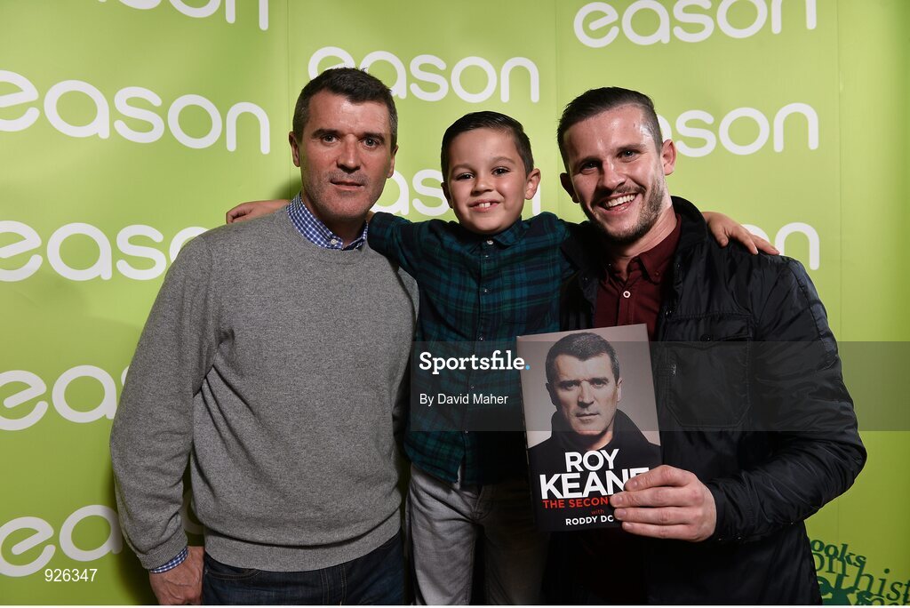 22 October 2014; Pictured is legendary former professional football player and current Republic of Ireland assistant manager Roy Keane, who marked the launch of his new book 'The Second Half' at an exclusive Eason event in the RDS. Joined on stage with co-author of the book, Roddy Doyle, Keane treated fans to some great insights into his life and achievements. Keane’s book, The Second Half, is currently on sale in Eason stores nationwide and online at www.easons.com. Pictured with Roy Keane are competition winners Wesley Clarke with his son Calum, age 7, from Palmerstown, Dublin. RDS, Ballsbridge, Dublin. Picture credit: David Maher / SPORTSFILE