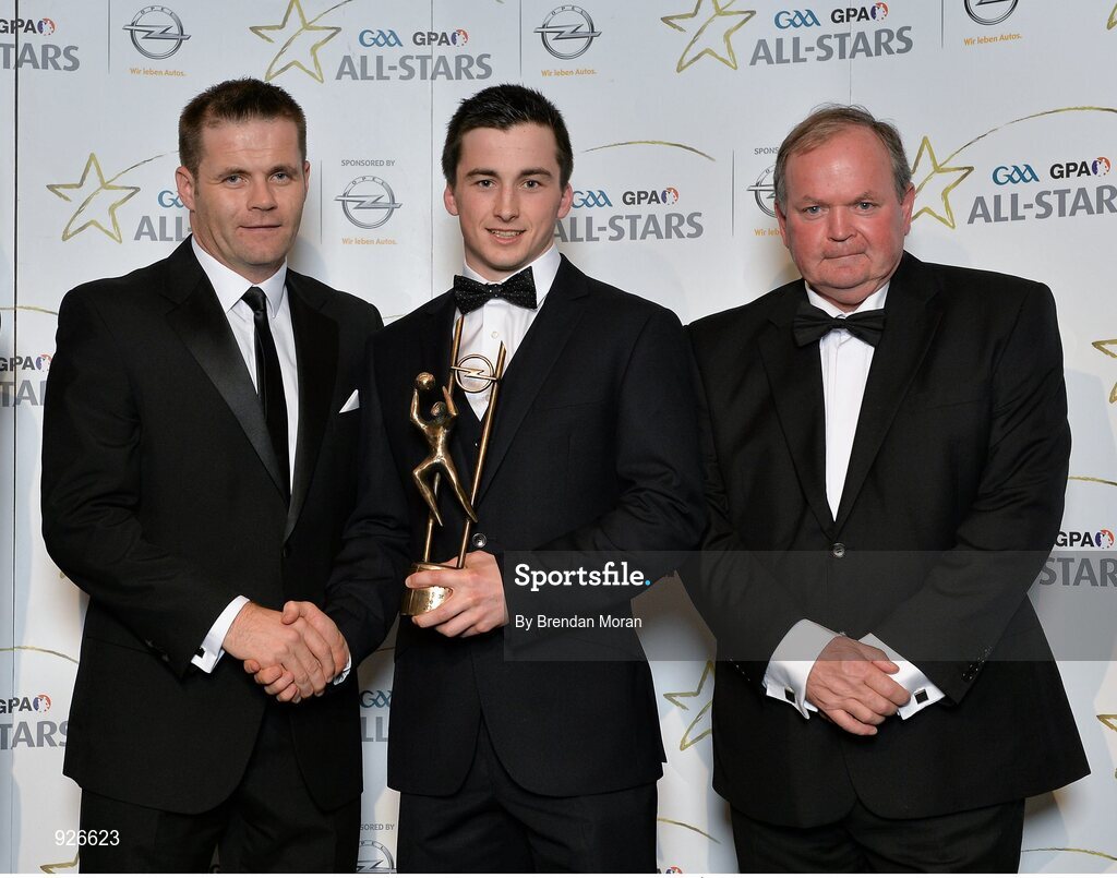 24 October 2014; Kerry footballer Paul Murphy is presented with his 2014 GAA GPA All-Star award by Uachtarán Chumann Lúthchleas Gael Liam Ó Néill and Dessie Farrell, Chief Executive of the Gaelic Players Association. GAA GPA All-Star Awards 2014 Sponsored by Opel. Convention Centre, Dublin. Picture credit: Brendan Moran / SPORTSFILE