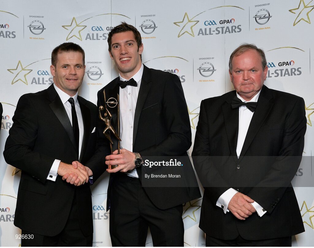 24 October 2014; Kerry footballer David Moran is presented with his 2014 GAA GPA All-Star award by Uachtarán Chumann Lúthchleas Gael Liam Ó Néill and Dessie Farrell, Chief Executive of the Gaelic Players Association. GAA GPA All-Star Awards 2014 Sponsored by Opel. Convention Centre, Dublin. Picture credit: Brendan Moran / SPORTSFILE