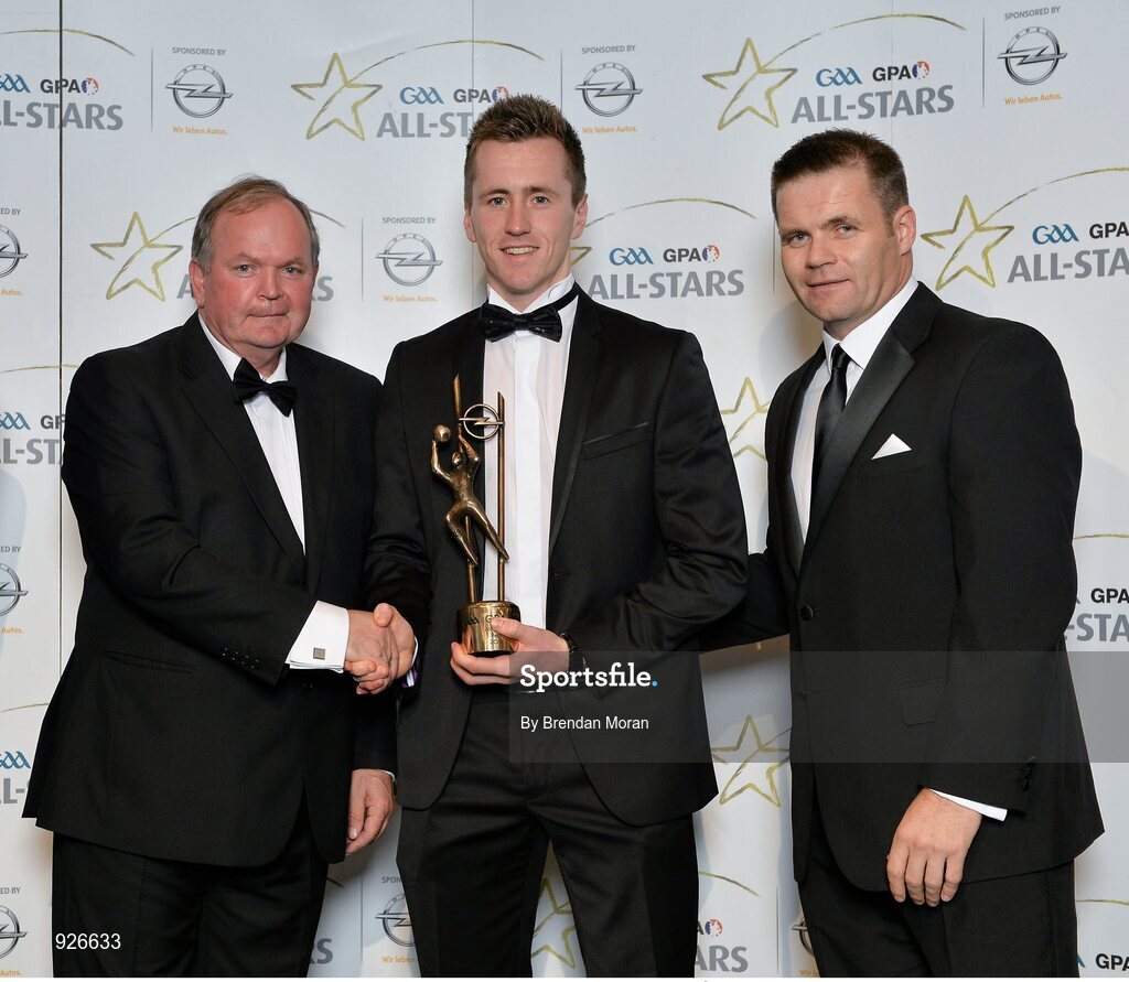 24 October 2014; Mayo footballer Cillian O'Connor is presented with his 2014 GAA GPA All-Star award by Uachtarán Chumann Lúthchleas Gael Liam Ó Néill and Dessie Farrell, Chief Executive of the Gaelic Players Association. GAA GPA All-Star Awards 2014 Sponsored by Opel. Convention Centre, Dublin. Picture credit: Brendan Moran / SPORTSFILE