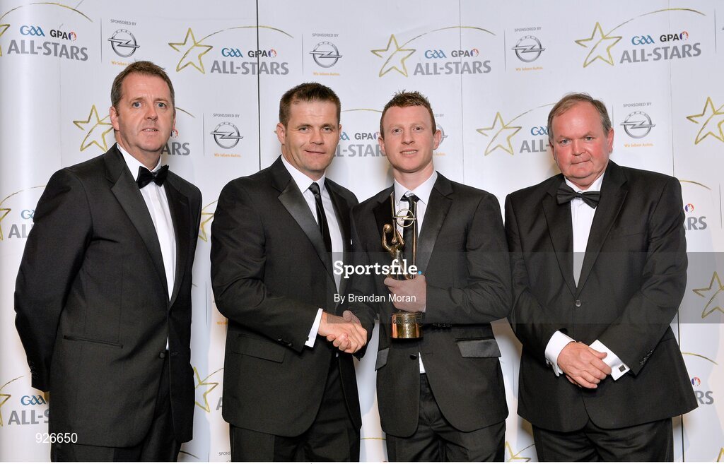 24 October 2014; Mayo footballer Colm Boyle is presented with his 2014 GAA GPA All-Star award by Uachtarán Chumann Lúthchleas Gael Liam Ó Néill, Dessie Farrell, Chief Executive of the Gaelic Players Association, and Dave Sheeran, Managing Director of Opel Ireland. GAA GPA All-Star Awards 2014 Sponsored by Opel. Convention Centre, Dublin. Picture credit: Brendan Moran / SPORTSFILE