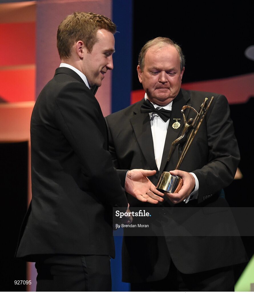 24 October 2014; Richie Hogan, Kilkenny, is presented with his All-Star award by Uachtarán Chumann Lúthchleas Gael Liam Ó Néill, during the 2014 GAA GPA All-Star Awards, sponsored by Opel. Convention Centre, Dublin.  Picture credit: Brendan Moran / SPORTSFILE