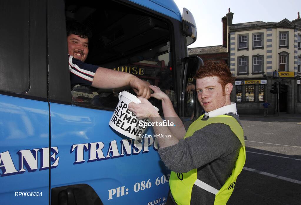 27 April 2007; Terenure College transition year student Rob Lynam collects a donation from truck driver Ger Kane, from Summerhill, Co. Meath, at Rathfarnham Road, Terenure, during the Special Olympics "Road to China" Collection Day, the aim of which is to provide more opportunities for people with a learning difficulty in their own communities and to help prepare Team Ireland for the 2007 World Games in China in October. Picture credit: Ray McManus / SPORTSFILE