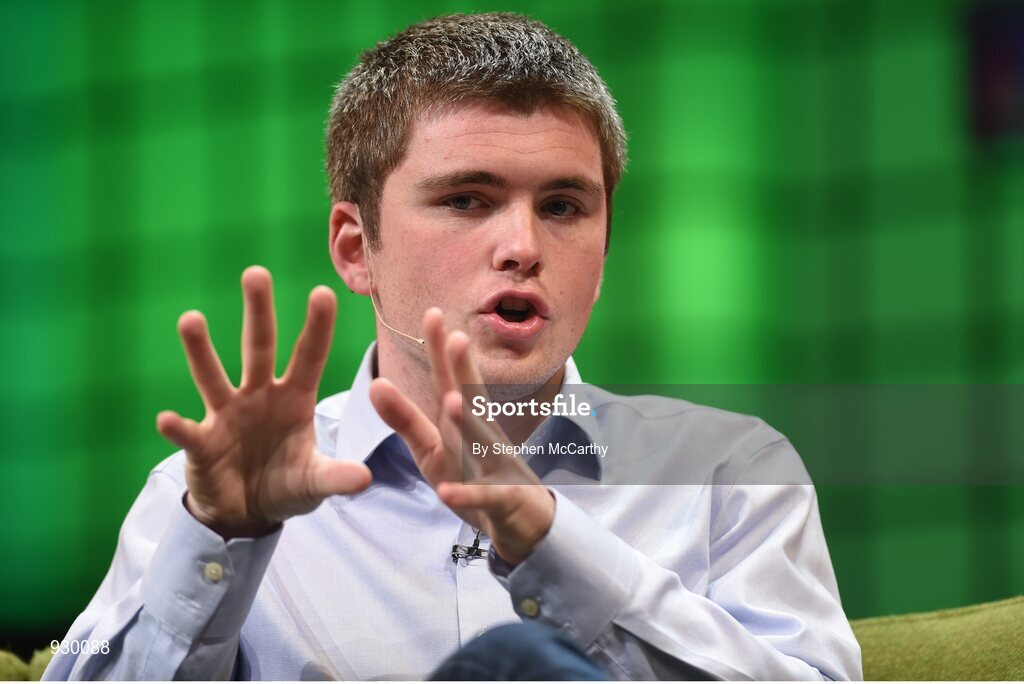 4 November 2014; John Collison, Stripe, in Conversation with David Rowan, Wired, on the centre stage during Day 1 of the 2014 Web Summit in the RDS, Dublin, Ireland. Picture credit: Stephen McCarthy / SPORTSFILE / Web Summit
