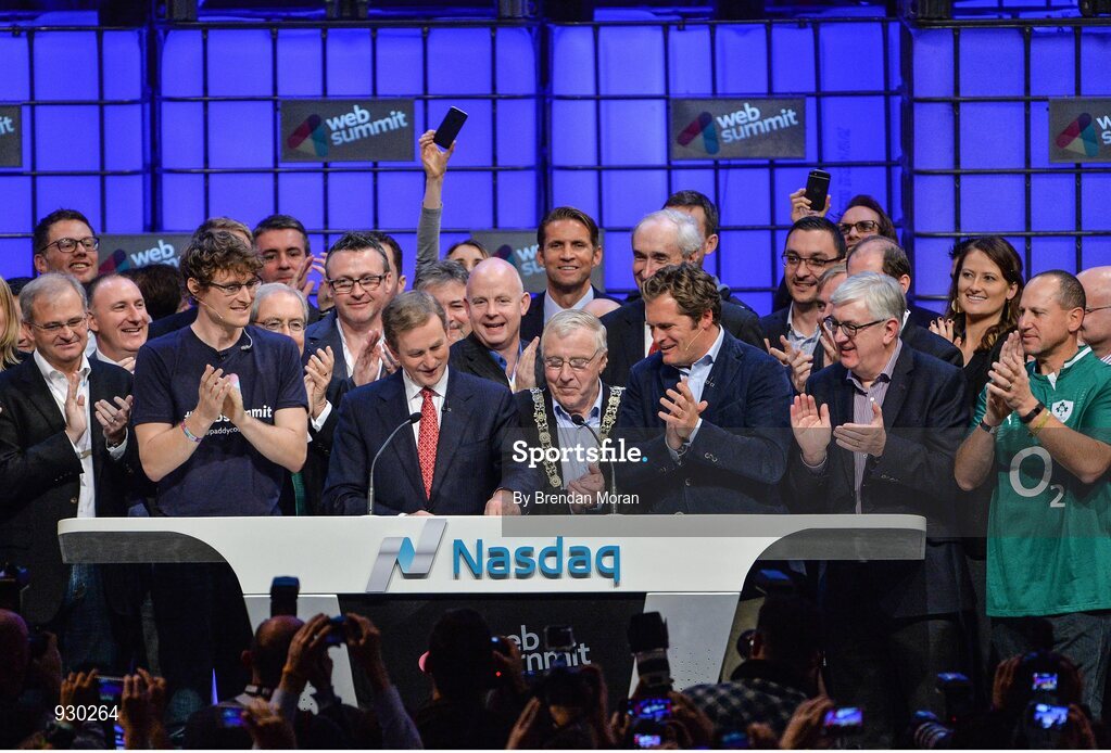 4 November 2014; An Taoiseach Enda Kenny, centre, rings the NASDAQ bell watched by, from left: Paddy Cosgrave, Founder and CEO, Web Summit; Cllr Christy Burke, Lord Major of Dublin; and Adam KostyÃ¡l, head of European Listings, NASDAQ OMX, on the centre stage during Day 1 of the 2014 Web Summit in the RDS, Dublin, Ireland. Picture credit: Brendan Moran / SPORTSFILE / Web Summit