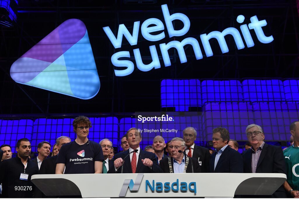 4 November 2014; An Taoiseach Enda Kenny, centre, rings the NASDAQ bell watched by, from left: Paddy Cosgrave, Founder and CEO, Web Summit; Cllr Christy Burke, Lord Major of Dublin; and Adam Kostyál, head of European Listings, NASDAQ OMX, on the centre stage during Day 1 of the 2014 Web Summit in the RDS, Dublin, Ireland. Picture credit: Stephen McCarthy / SPORTSFILE / Web Summit