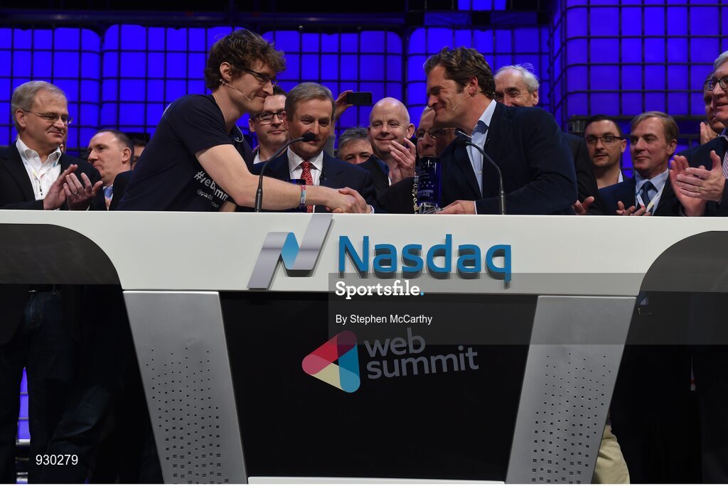 4 November 2014; Paddy Cosgrave, left, Founder and CEO, Web Summit, shakes hands with Adam Kostyál, head of European Listings, NASDAQ OMX, on the centre stage during Day 1 of the 2014 Web Summit in the RDS, Dublin, Ireland. Picture credit: Stephen McCarthy / SPORTSFILE / Web Summit