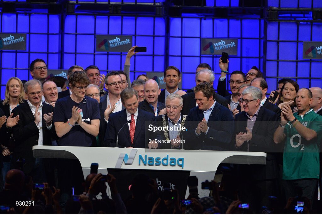 4 November 2014; An Taoiseach Enda Kenny, centre, rings the NASDAQ bell watched by, from left: Paddy Cosgrave, Founder and CEO, Web Summit; Cllr Christy Burke, Lord Major of Dublin; and Adam Kostyál, Head of European Listings, NASDAQ OMX, on the centre stage during Day 1 of the 2014 Web Summit in the RDS, Dublin, Ireland. Picture credit: Brendan Moran / SPORTSFILE / Web Summit