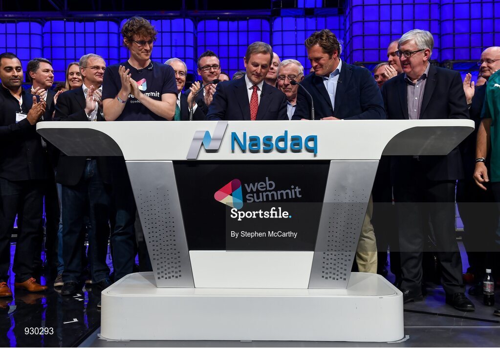4 November 2014; An Taoiseach Enda Kenny, centre, rings the NASDAQ bell watched by, from left: Paddy Cosgrave, Founder and CEO, Web Summit; Cllr Christy Burke, Lord Major of Dublin; and Adam KostyÃ¡l, Head of European Listings, NASDAQ OMX, on the centre stage during Day 1 of the 2014 Web Summit in the RDS, Dublin, Ireland. Picture credit: Stephen McCarthy / SPORTSFILE / Web Summit