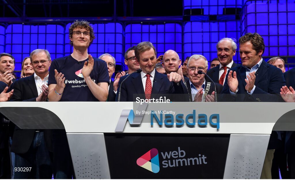 4 November 2014; An Taoiseach Enda Kenny, centre, rings the NASDAQ bell watched by, from left: Paddy Cosgrave, Founder and CEO, Web Summit; Cllr Christy Burke, Lord Major of Dublin; and Adam KostyÃ¡l, Head of European Listings, NASDAQ OMX, on the centre stage during Day 1 of the 2014 Web Summit in the RDS, Dublin, Ireland. Picture credit: Stephen McCarthy / SPORTSFILE / Web Summit