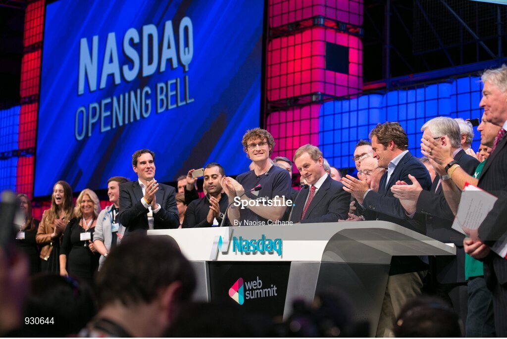 4 November 2014; An Taoiseach Enda Kenny, centre, rings the NASDAQ bell watched by, from left: Paddy Cosgrave, Founder and CEO, Web Summit; Cllr Christy Burke, Lord Major of Dublin; and Adam KostyÃ¡l, head of European Listings, NASDAQ OMX, on the centre stage during Day 1 of the 2014 Web Summit in the RDS, Dublin, Ireland. Picture credit: Naoise Culhane / SPORTSFILE / Web Summit