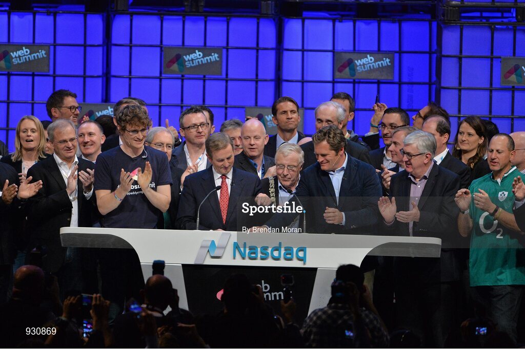 4 November 2014; An Taoiseach Enda Kenny, centre, rings the NASDAQ bell watched by, from left: Paddy Cosgrave, Founder and CEO, Web Summit; Cllr Christy Burke, Lord Major of Dublin; and Adam Kostyál, Head of European Listings, NASDAQ OMX, on the centre stage during Day 1 of the 2014 Web Summit in the RDS, Dublin, Ireland. Picture credit: Brendan Moran / SPORTSFILE / Web Summit