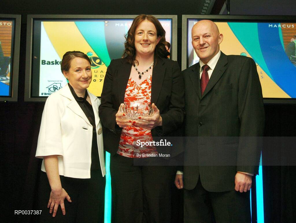 26 May 2007; Orla Dempsey, centre, receives the Wheelchair Player of the Year award on behalf of Marcus Causton, from Mairead Faqquharson, left, and Tony Colgan, President of Basketball Ireland. Basketball Ireland Annual Awards 2007, Citywest Hotel, Conference, Leisure & Golf Resort, Saggart, Co Dublin. Picture credit: Brendan Moran / SPORTSFILE