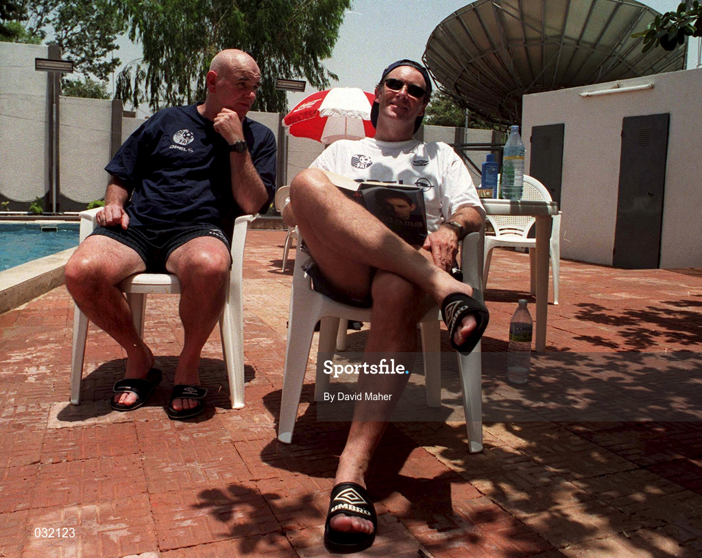 30 March 1999; Republic of Ireland manager Brian Kerr and assistant manager Noel O'Reilly, left, relax beside the pool at their team hotel in Kano, Nigeria, at the 1999 FIFA World Youth Championship Finals. Photo by David Maher/Sportsfile