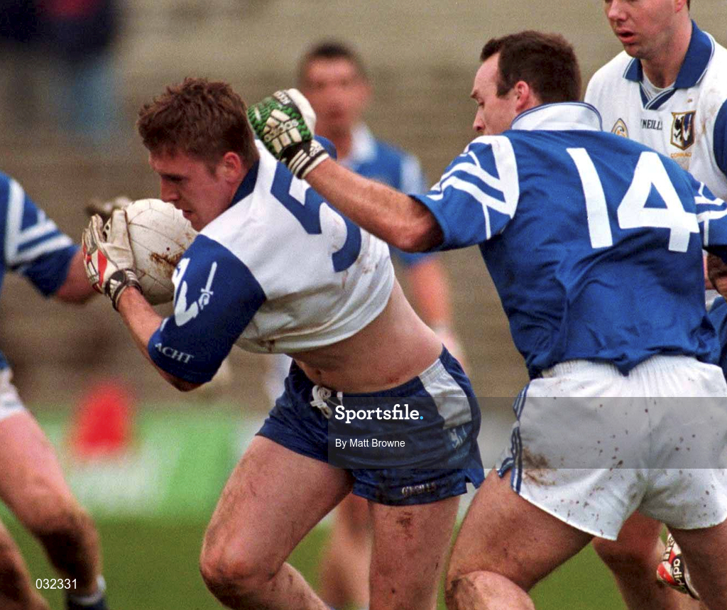 30 January 2000; David Heaney of Connacht is tackled by Johnny Crowley of Munster during the Railway Cup Football Championship Semi-Final between Connacht and Munster at McHale Park in Castlebar, Mayo. Photo by Matt Browne/Sportsfile