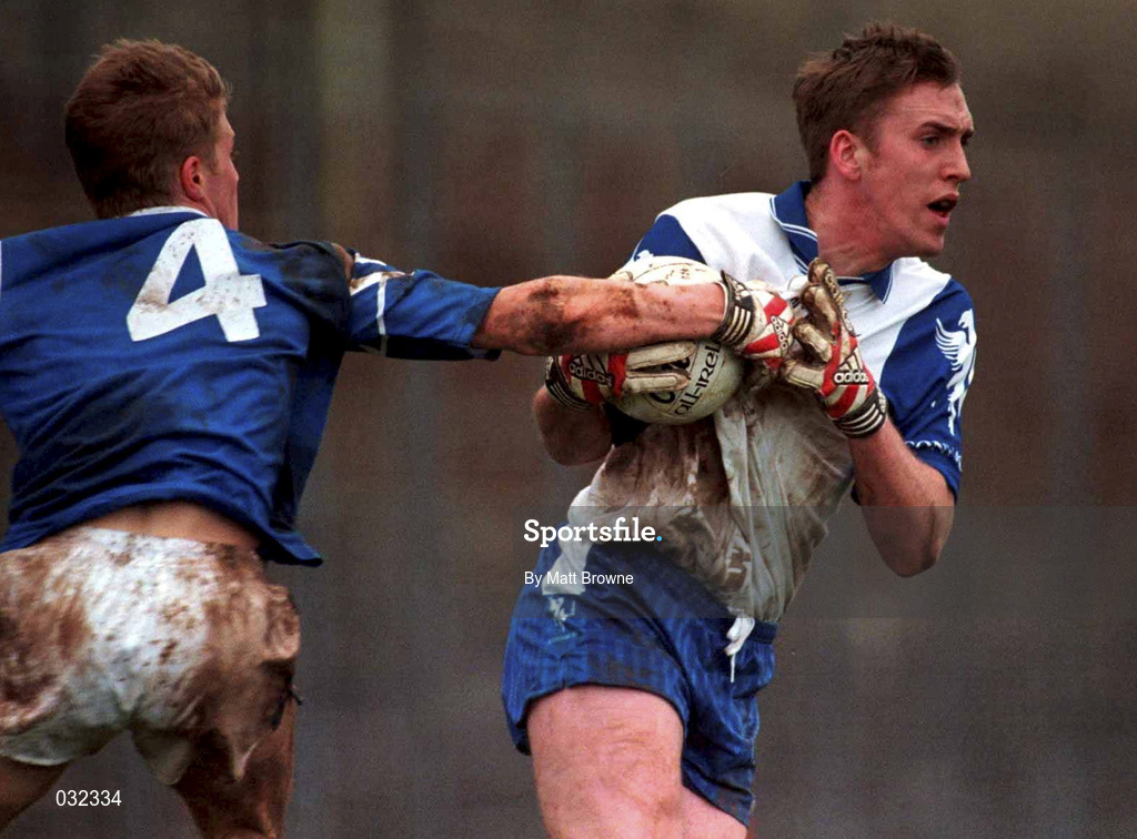 30 January 2000; David Heaney of Connacht is tackled by  Anthony Lynch of Munster during the Railway Cup Football Championship Semi-Final between Connacht and Munster at McHale Park in Castlebar, Mayo. Photo by Matt Browne/Sportsfile