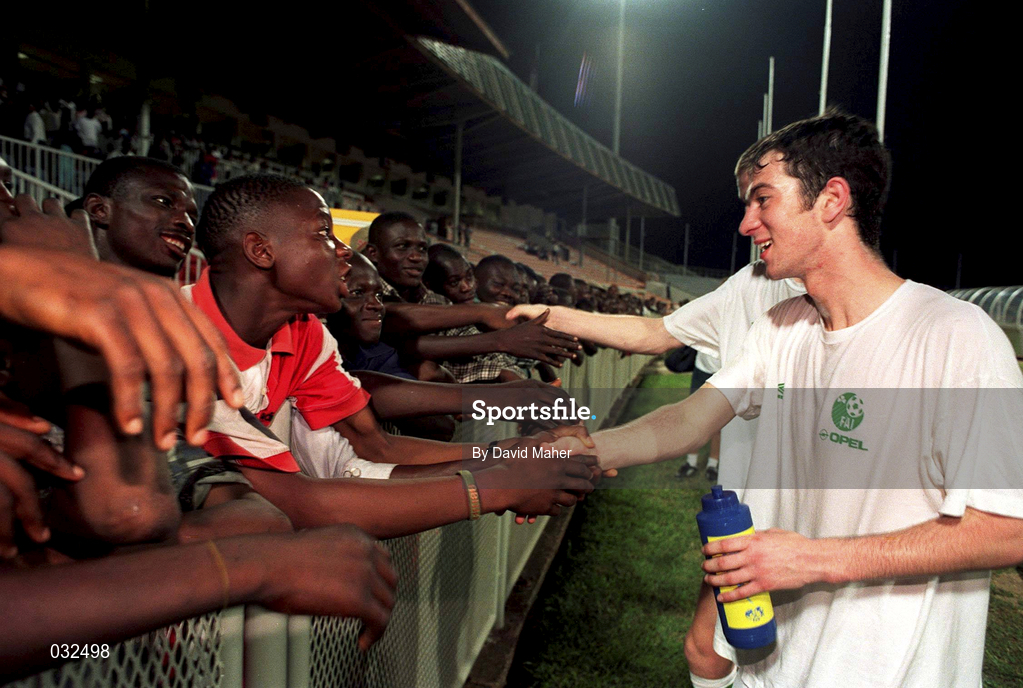 30 March 1999; Keith Doyle greets locals following a Republic of Ireland training session at Liberty Stadium in Ibadan, Nigeria. Photo by David Maher/Sportsfile