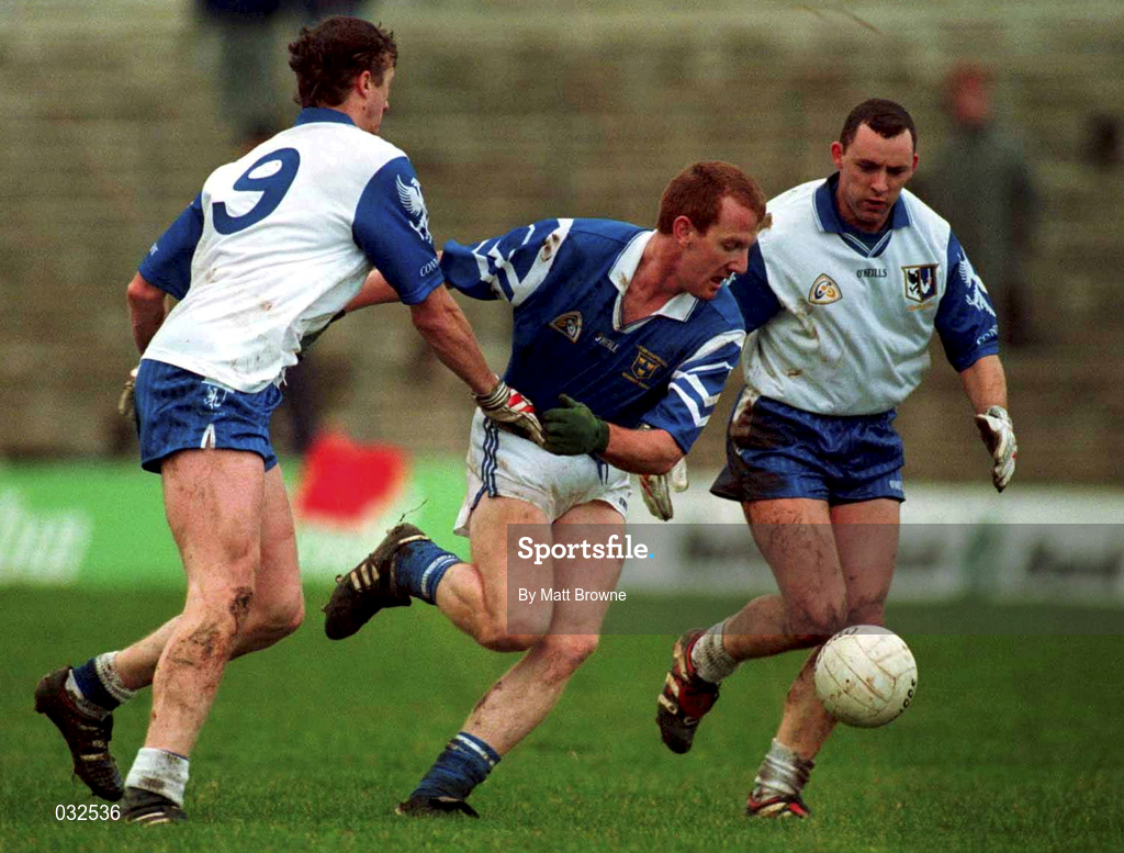 30 January 2000; Liam Hassett of Munster is tackled by Jarlath Fallon, 9, and Kenneth Mortimer of Connacht during the Railway Cup Football Championship Semi-Final between Connacht and Munster at McHale Park in Castlebar, Mayo. Photo by Matt Browne/Sportsfile
