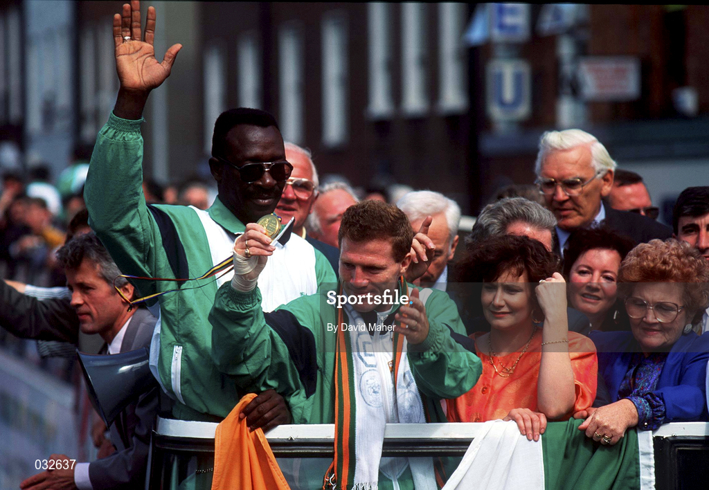 11 August 1992; Olympic Champion Michael Carruth, holding his gold medal, accompanied by his wife Paula and coach Nicholas Cruz, on board the bus which drove them through the streets of Dublin during the Irish Olympic team's homecoming from the 1992 Olympic Games in Barcelona, Spain. Photo by David Maher/Sportsfile