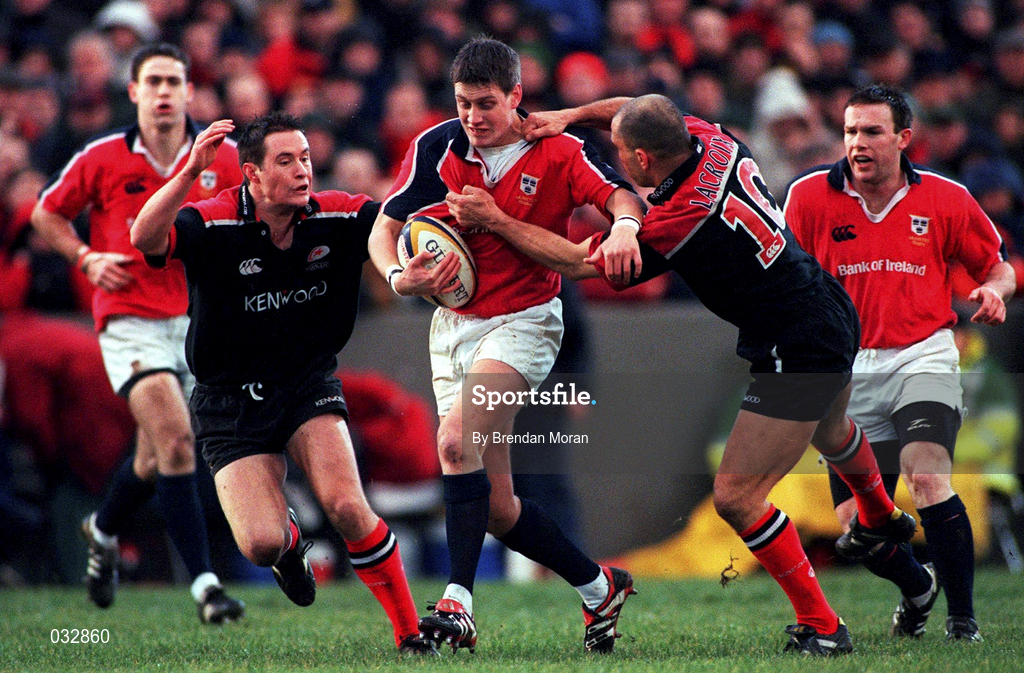 8 January 2000; Ronan O'Gara of Munster in action against Nick Walsh, left, and theirry Lacroix of Saracens during the Heineken Cup Pool 4 Round 5 match between Munster and Saracens at Thomond Park in Limerick. Photo by Brendan Moran/Sportsfile