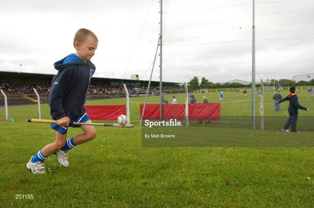 3 June 2007; Waterford fan Kealan Daly, age 7, with his hurley and sliotar as the Waterford Senior football team warms up before the start of the game. Bank of Ireland Munster Senior Football Championship Semi-Final, Waterford v Kerry, Fraher Field, Dungarvan, Co. Waterford. Picture credit: Matt Browne / SPORTSFILE