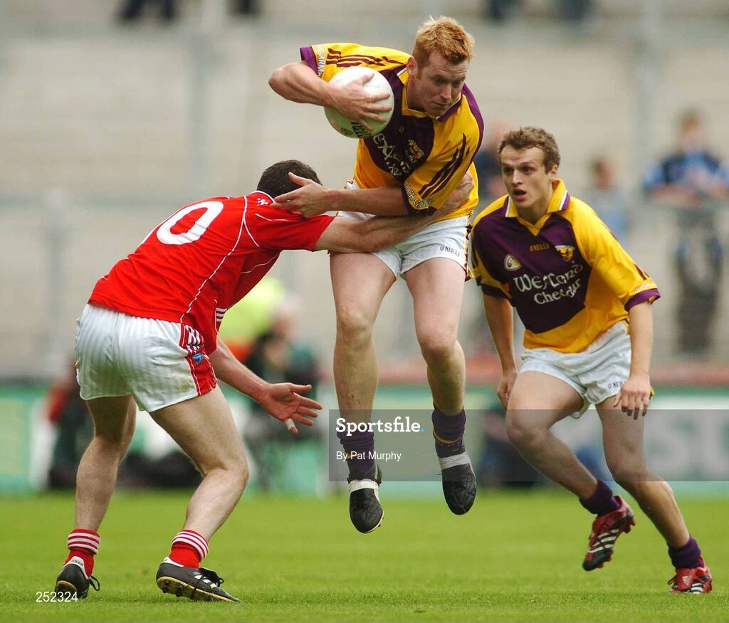 17 June 2007; Eric Bradley, Wexford, in action against Martin Farrelly, Louth. Bank of Ireland Leinster Senior Football Championship Quarter-Final, Louth v Wexford, Croke Park, Dublin. Picture credit: Pat Murphy / SPORTSFILE