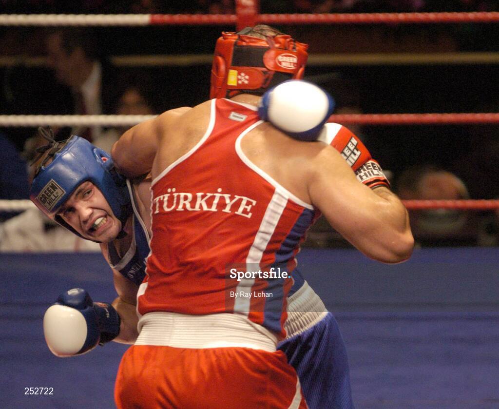 19 June 2006: Ireland’s Cathal MacMonagle, Blue, in action against Kurban Gunebakan, Turkey. 5th European Union Boxing Championships, Super Heavy Weight +91kg Premliminary Round, Cathal MacMonagle, Ireland v Kurban Gunebakan, Turkey, National Stadium, Dublin. Picture credit: Ray Lohan / SPORTSFILE